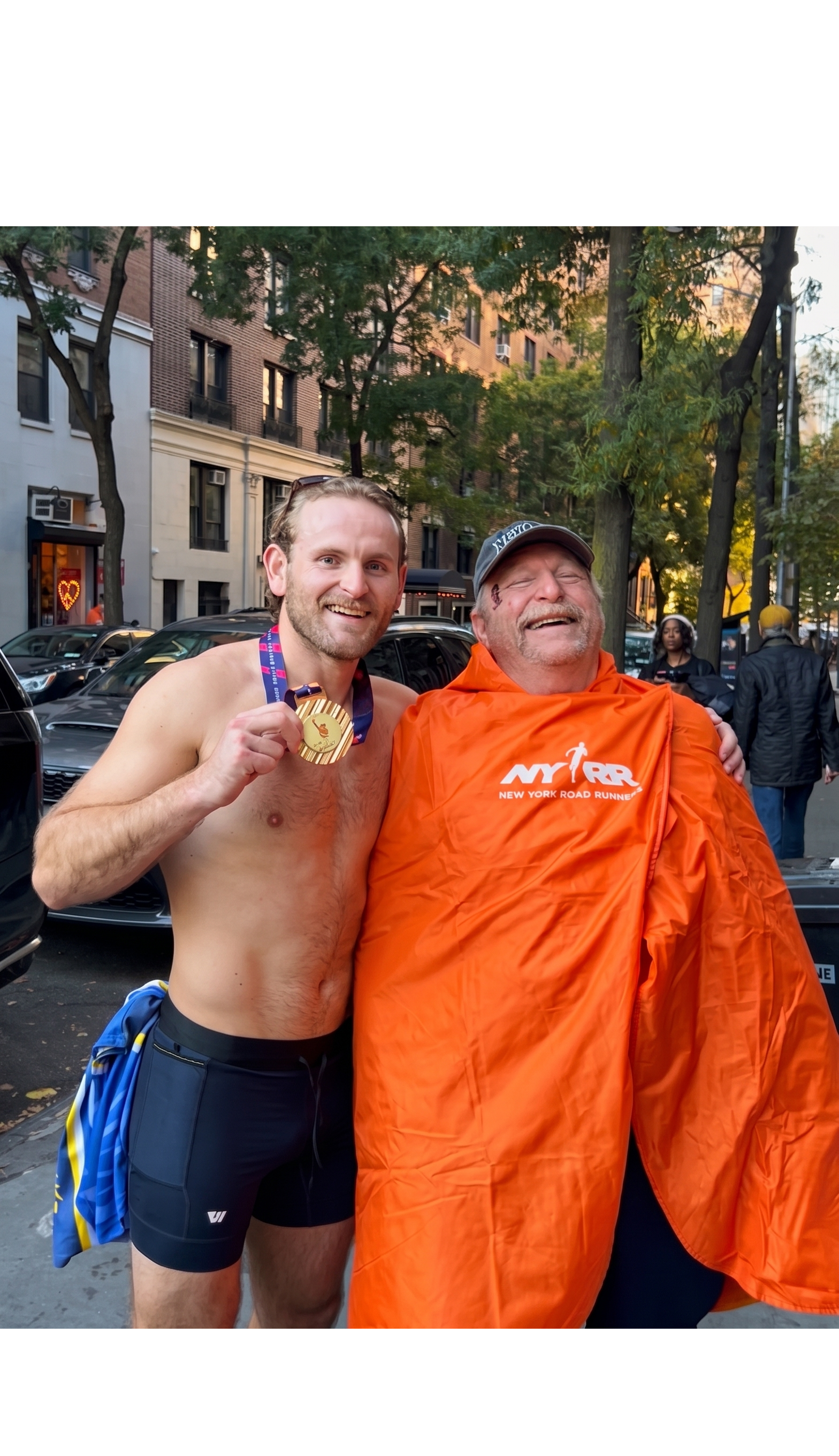 Vincent with his father after the 2025 NYC Marathon